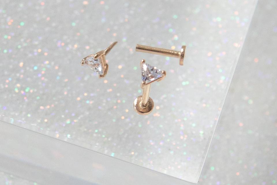 14k facet tragus piercing