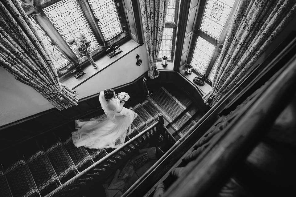 Bride walks down stairs