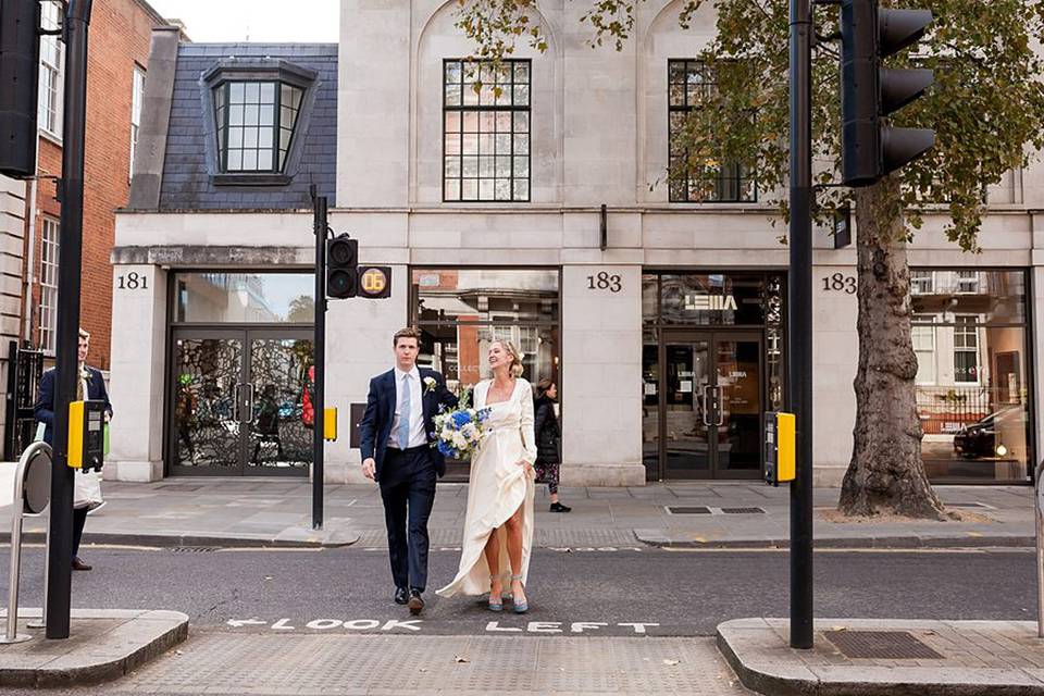 Newlyweds crossing the road