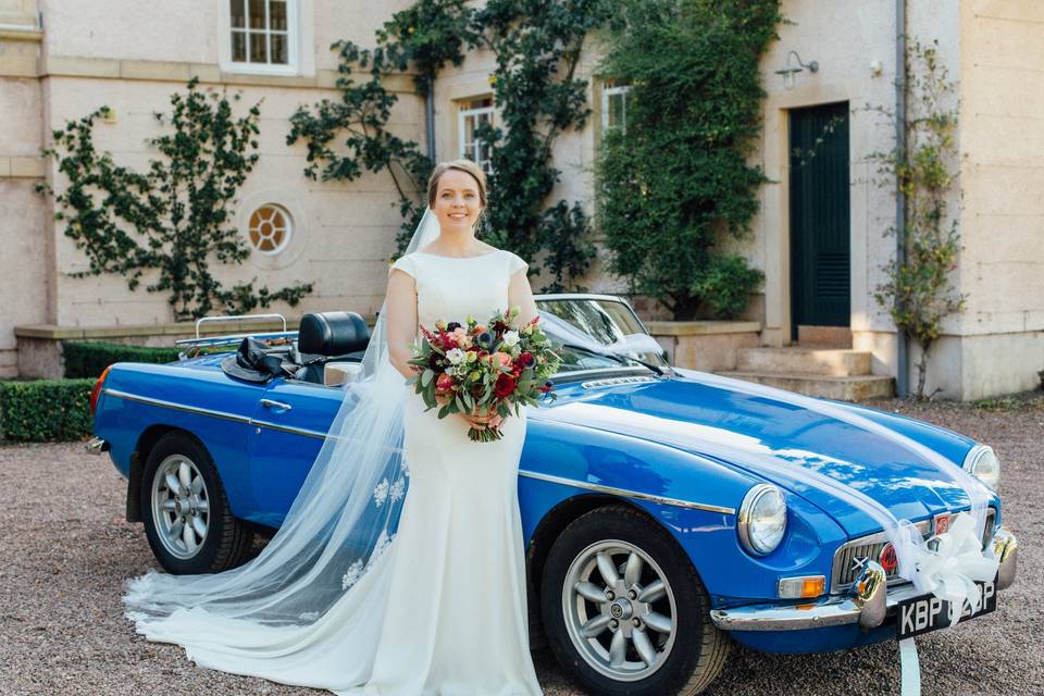 Bride beside a classic car - Sarah Fulton Photography