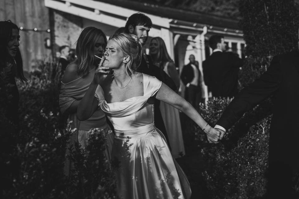 Smoking bride during a wedding