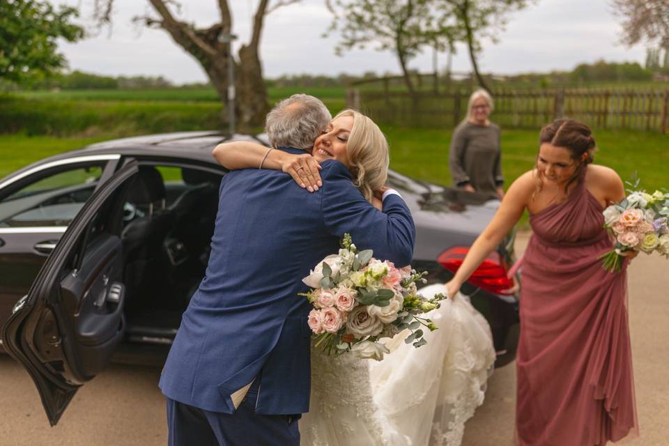 Bride hugging father