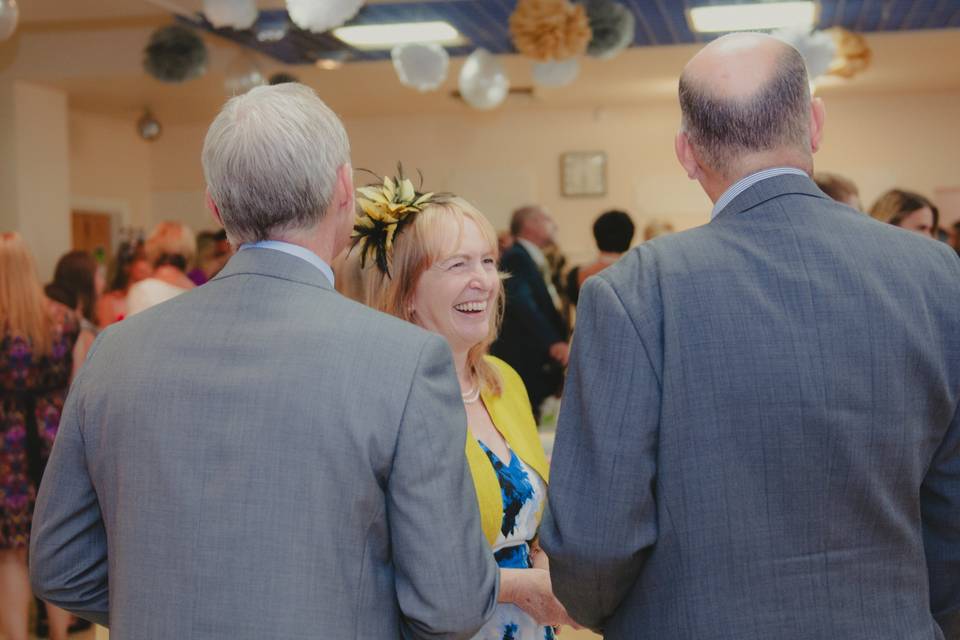 Guests smile and chat