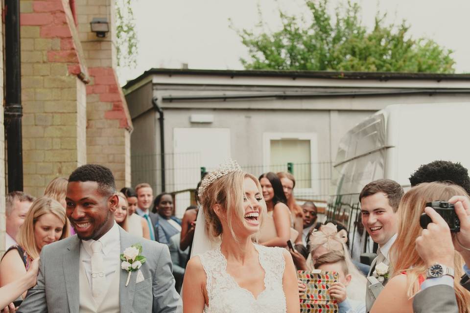 Bride and groom exit church