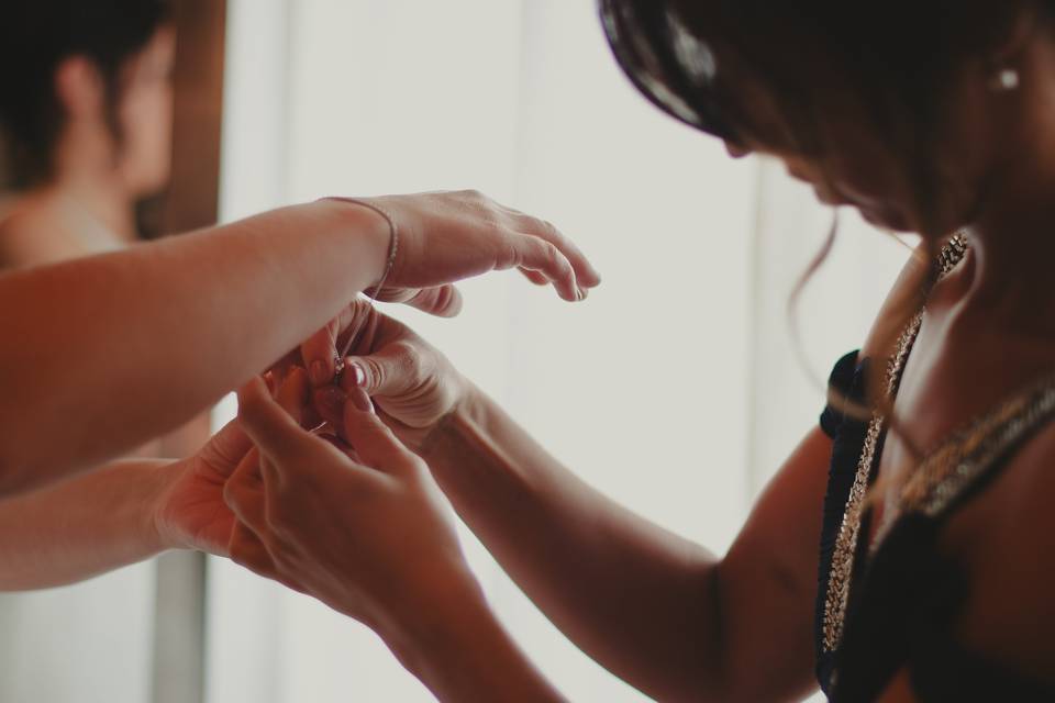 Bride puts on jewellery