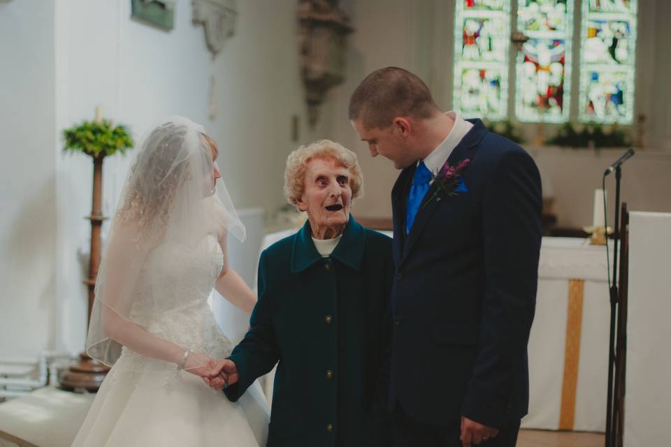 Bride and groom with guest
