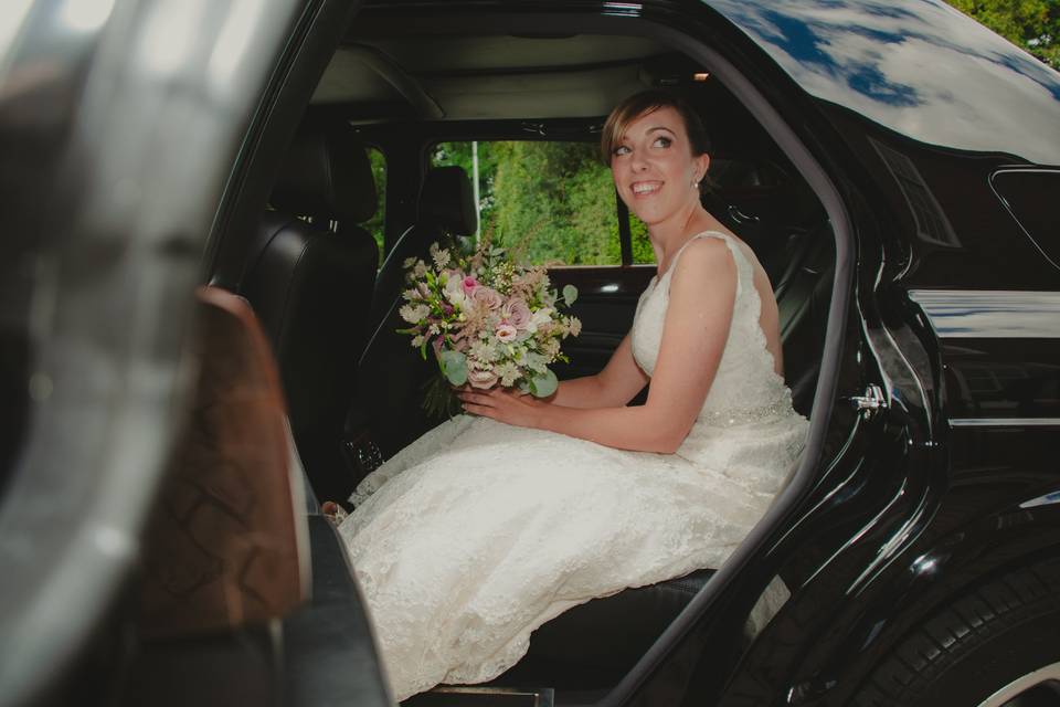 Bride waits to leave car