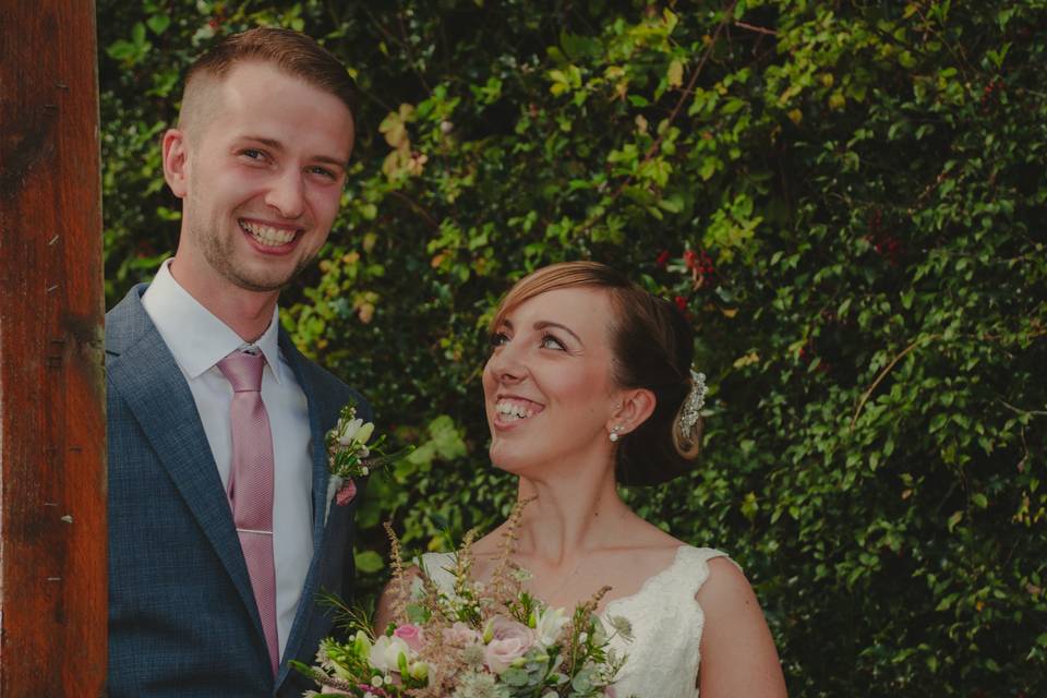Bride and groom smile