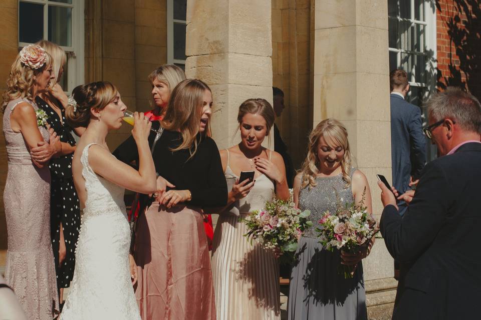 Bride and family outside venue