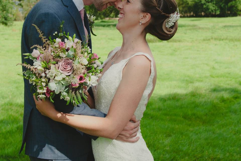 Bride and groom embrace