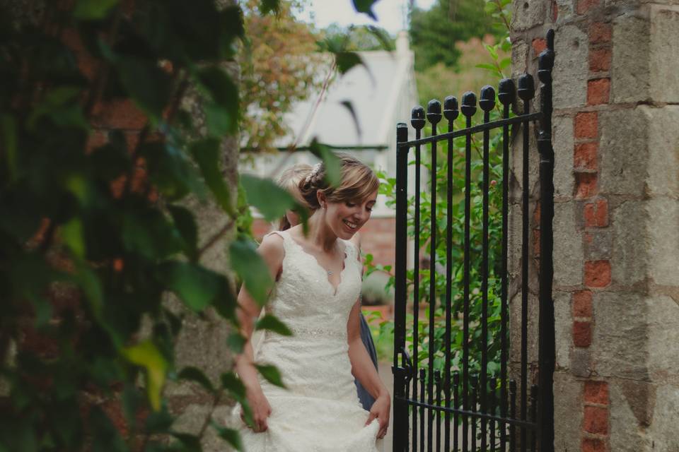 Bride peeks around the corner