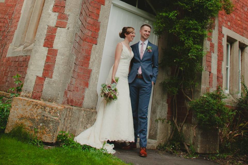 Bride & groom pose for guests