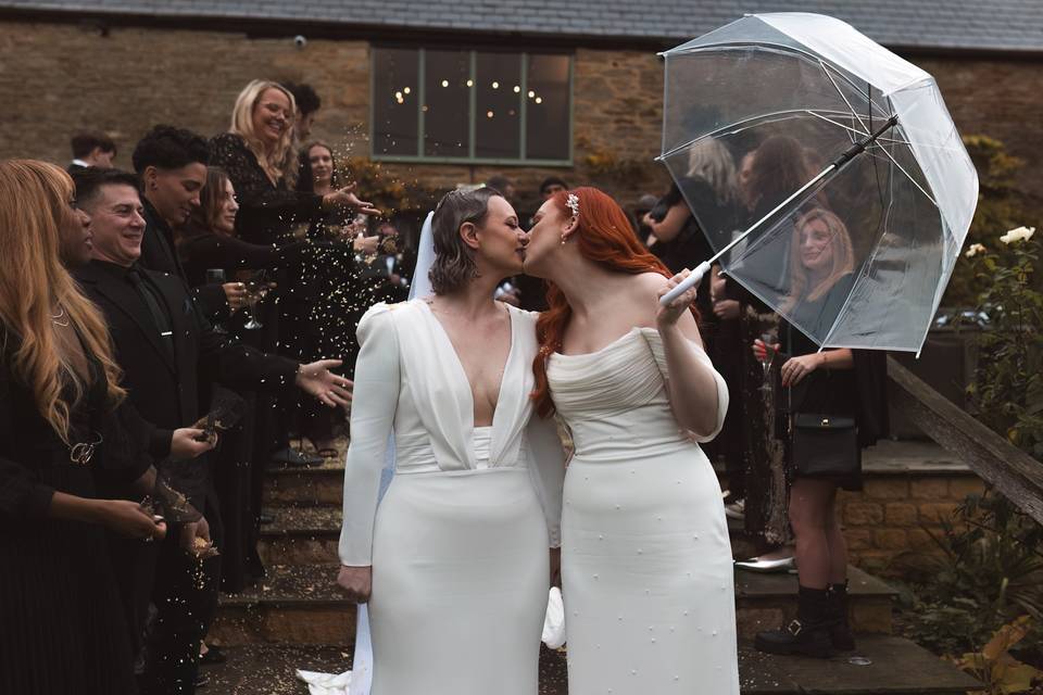 Romantic wedding umbrella kiss