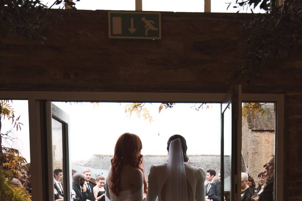 Newlyweds holding hands indoor