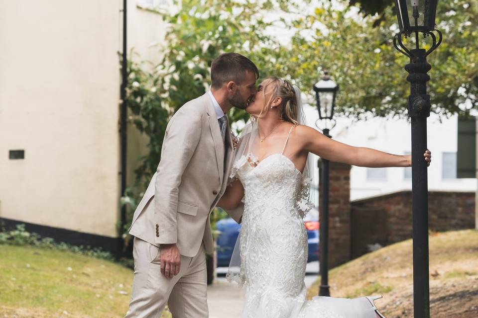 Couple pose outside of church