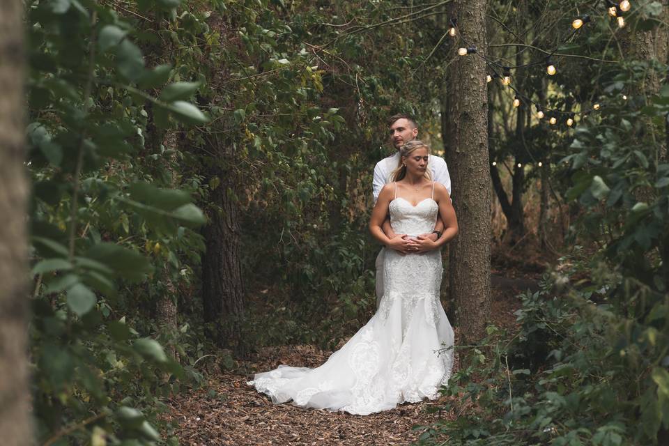 Couple pose in woods