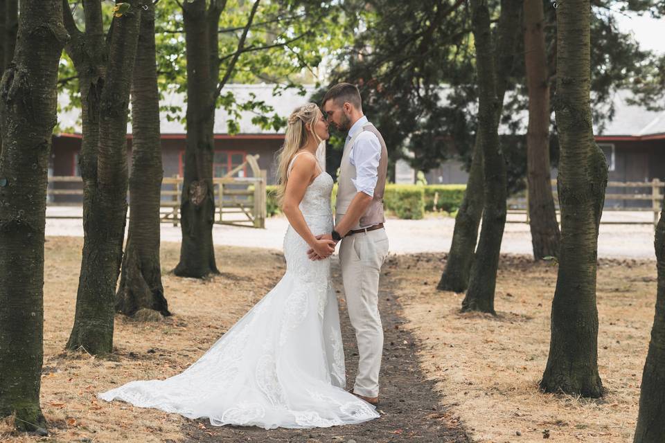 Couple pose in the woods