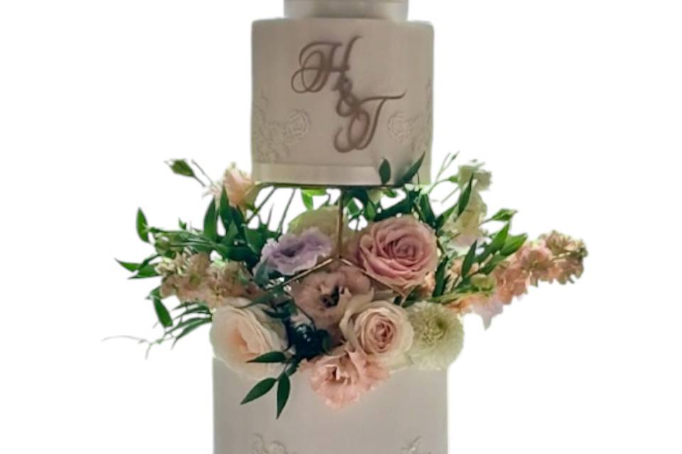 White iced cake, fresh flowers