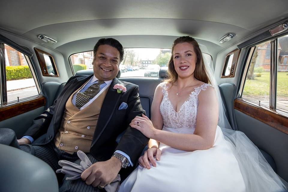 Bride and groom in Rolls Royce