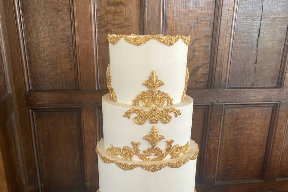 White and gold wedding cake