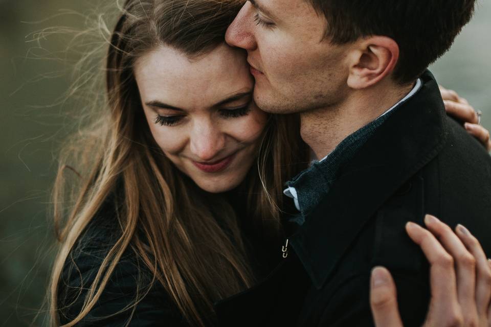 Couple embracing - Blue Lily Weddings