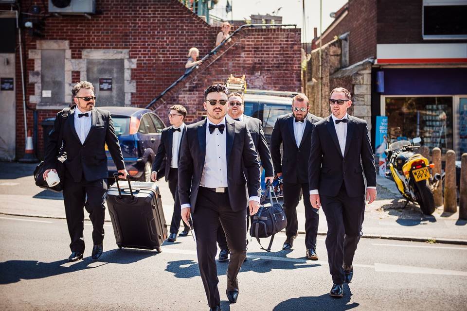 The groomsmen in black tie