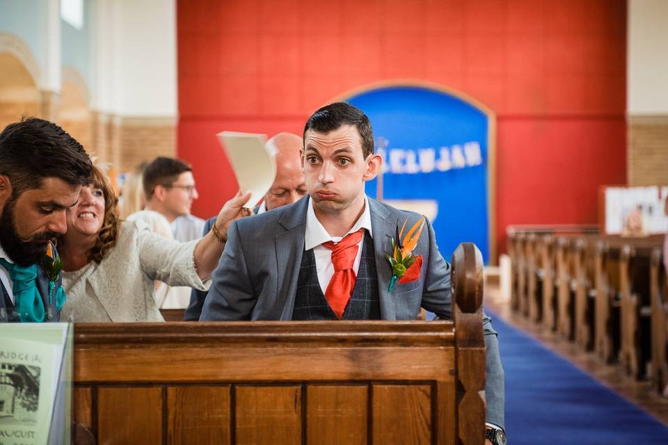 Nervous groom waits in church