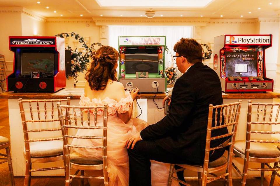 Bride & groom play video games