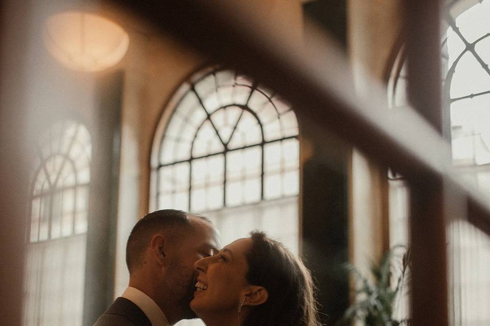 Reflection of couple hugging