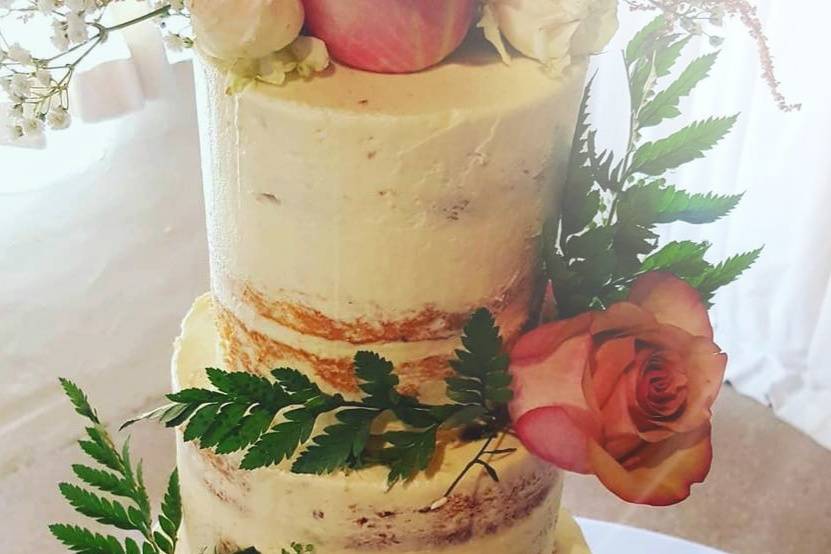 Naked scraped cake with flowers