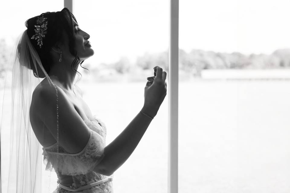 The Bride putting perfume on