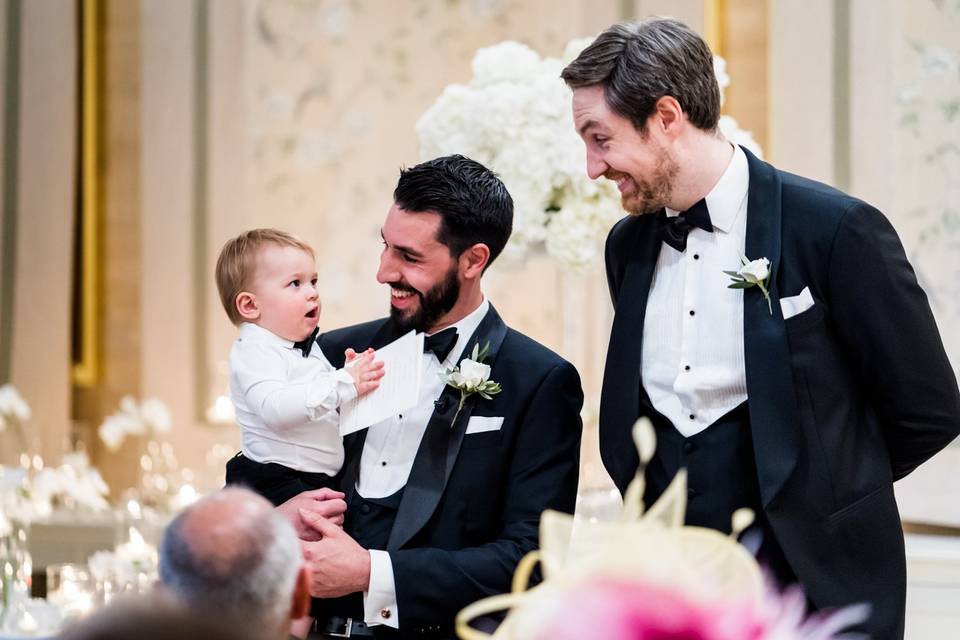 Baby with groomsmen