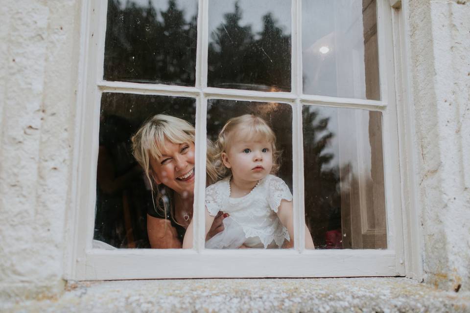 Bridesmaids through a window