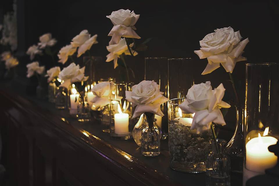 Moody candles and white roses