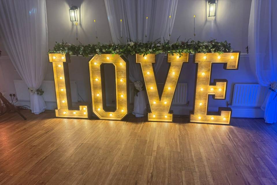 Beautifully dressed love sign