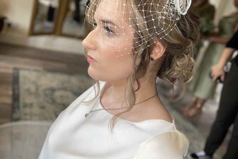 Bridal updo with birdcage veil