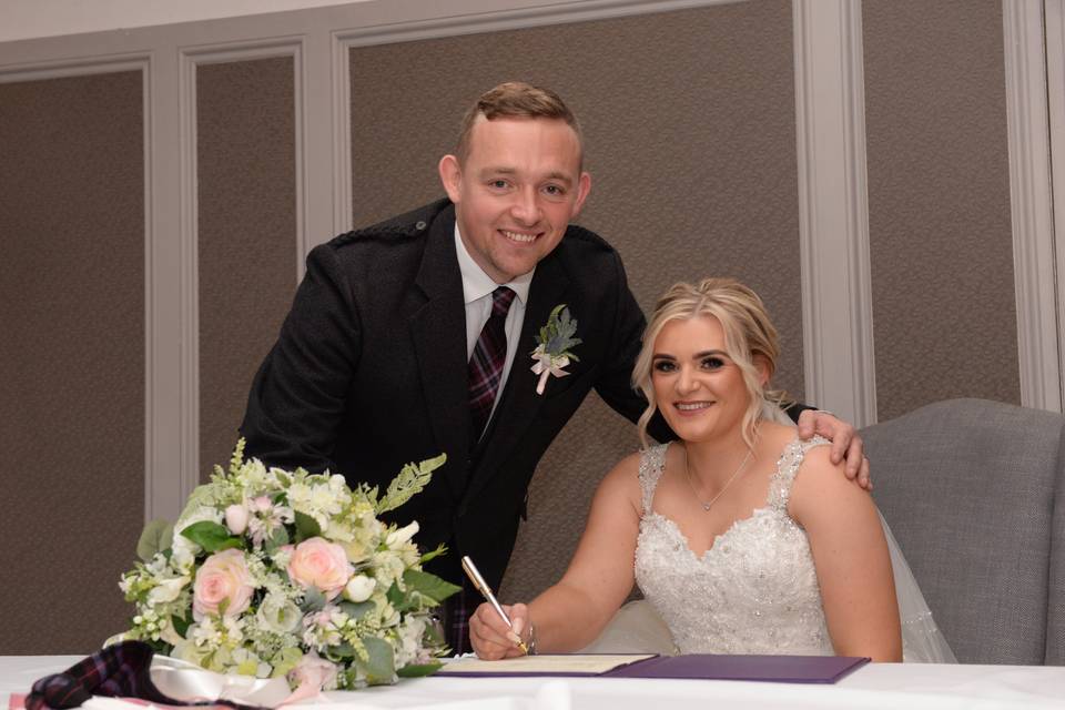 Signing the register - Love Weddings Aberdeen