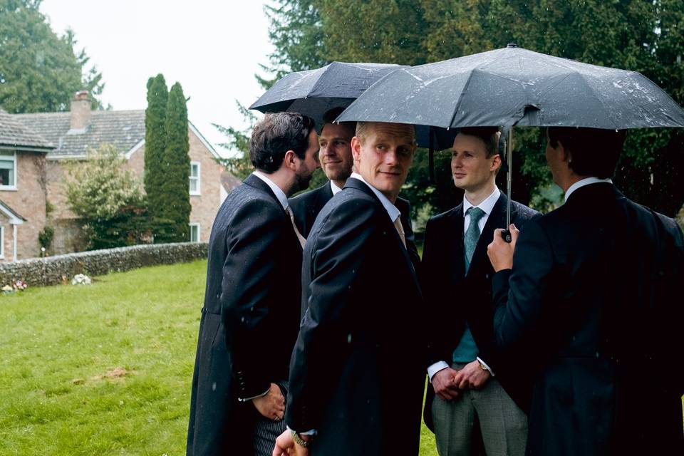 Groomsmen in the rain