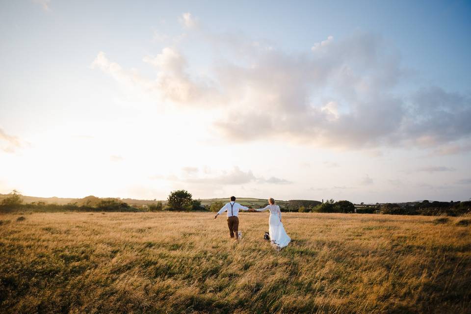Walking Through A Sunset Field