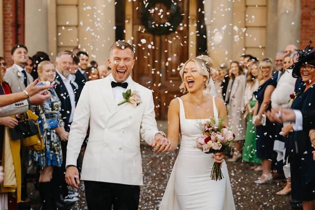 Bride and groom confetti exit