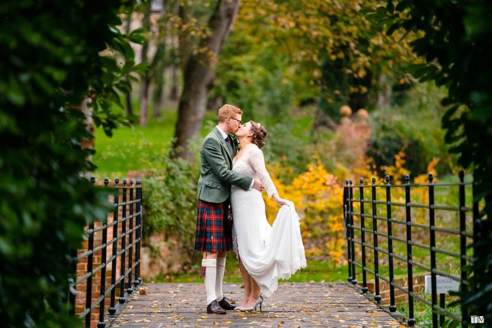 A kiss in a bespoke gown