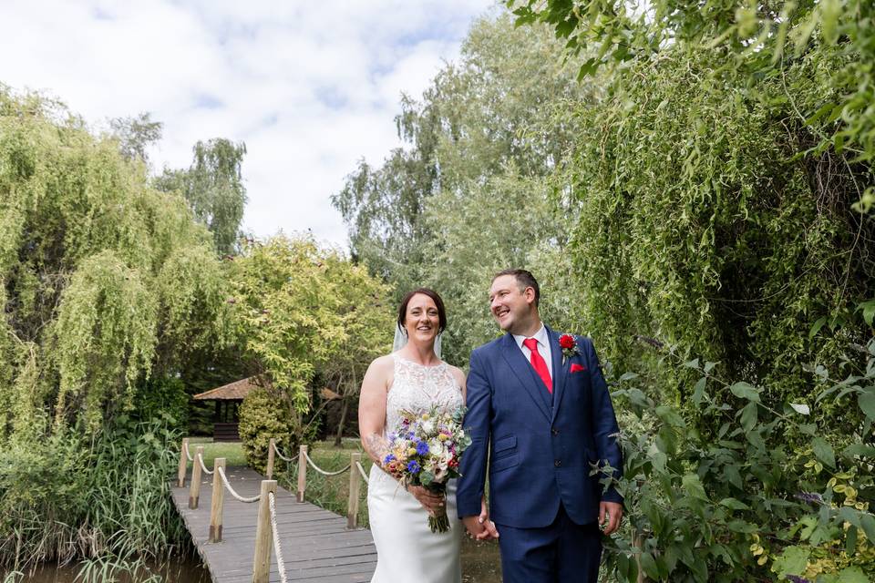 Couple walking across bridge