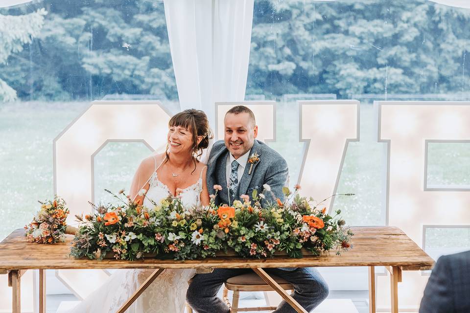 Couple in front of LOVE letter