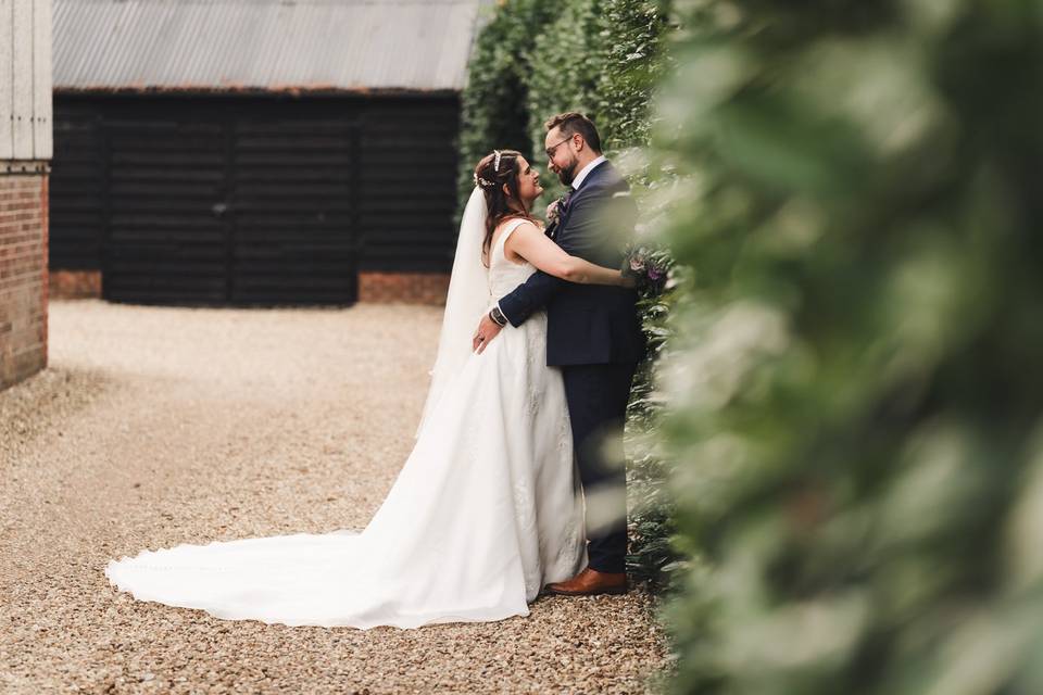 Couple outside hedges