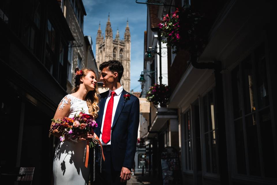 Groom helps Bride on the wall