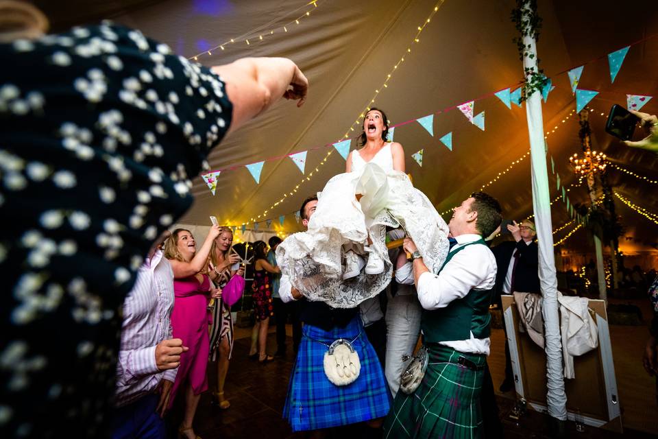 Lifting the bride in a chair