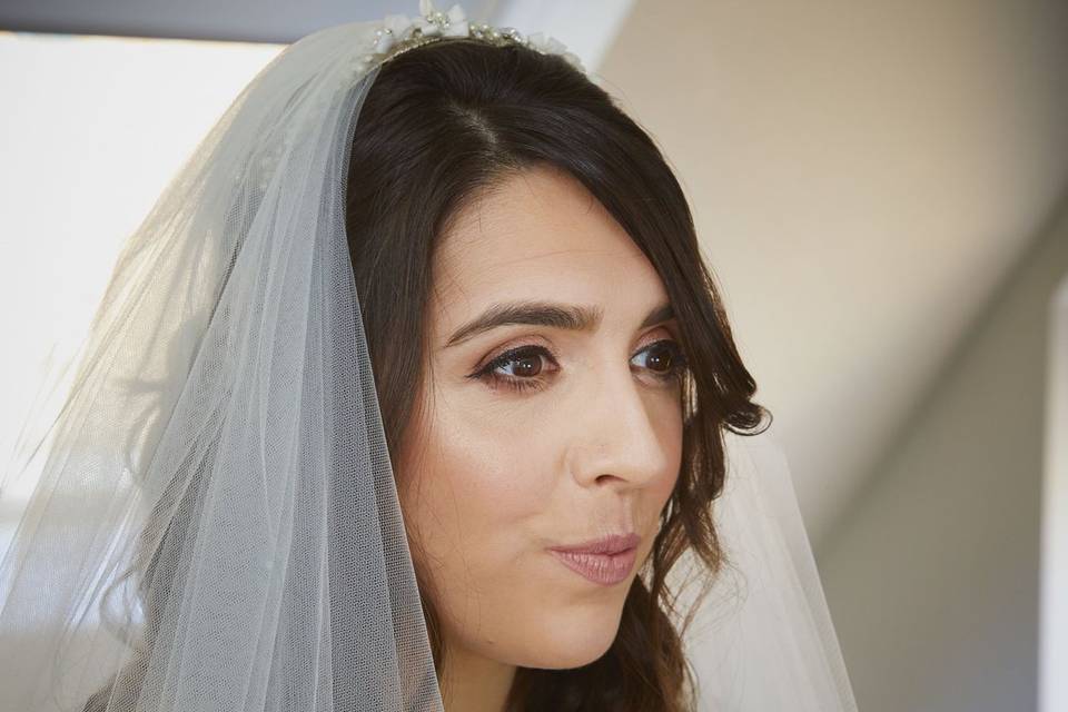 Bride looking in mirror