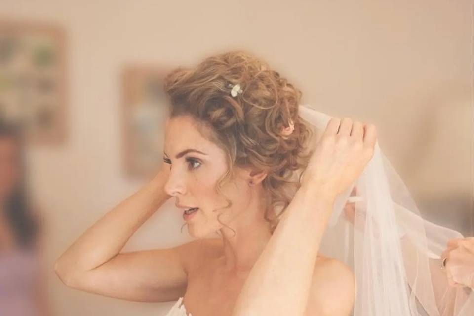 Whimsical updo on curly hair