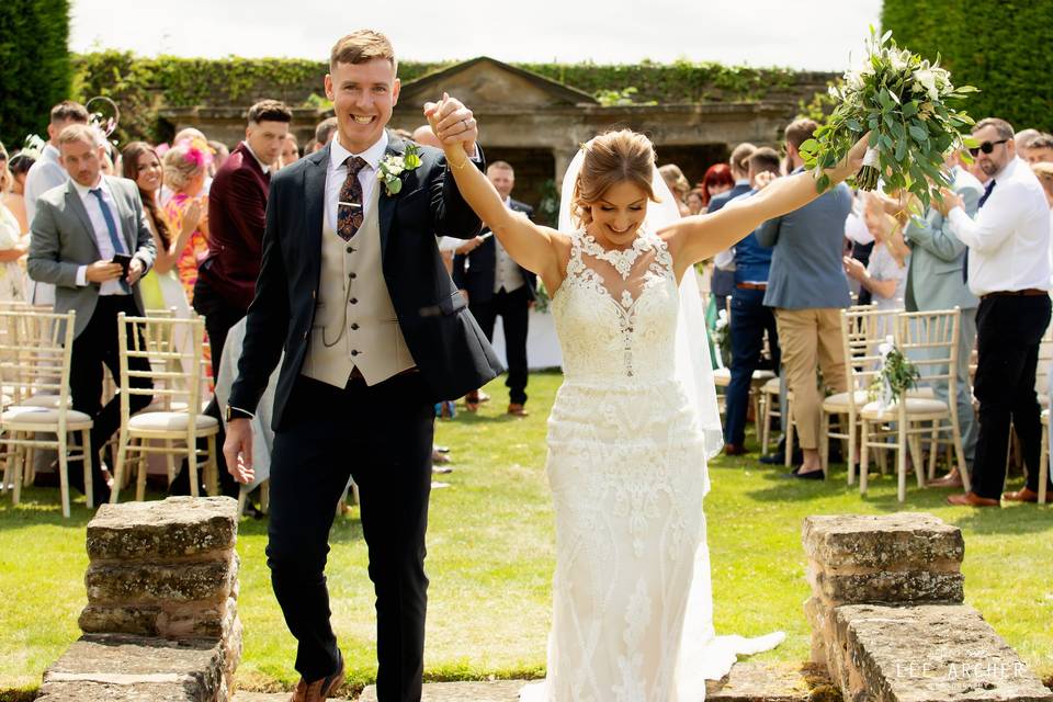 Bride & Groom leaving happy