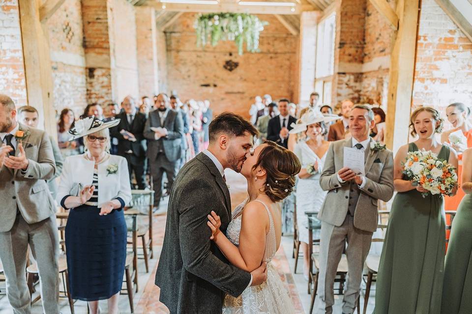 Bride and grooms first kiss